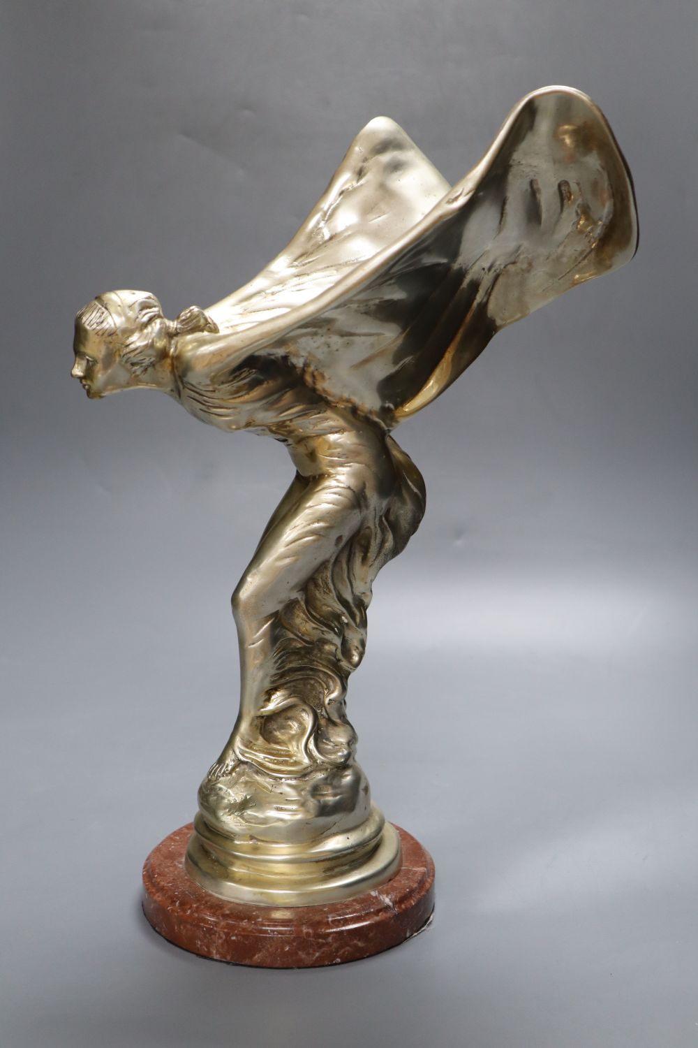 A silver plated figure in the style of Spirit of Ecstasy after Sykes, 39cm